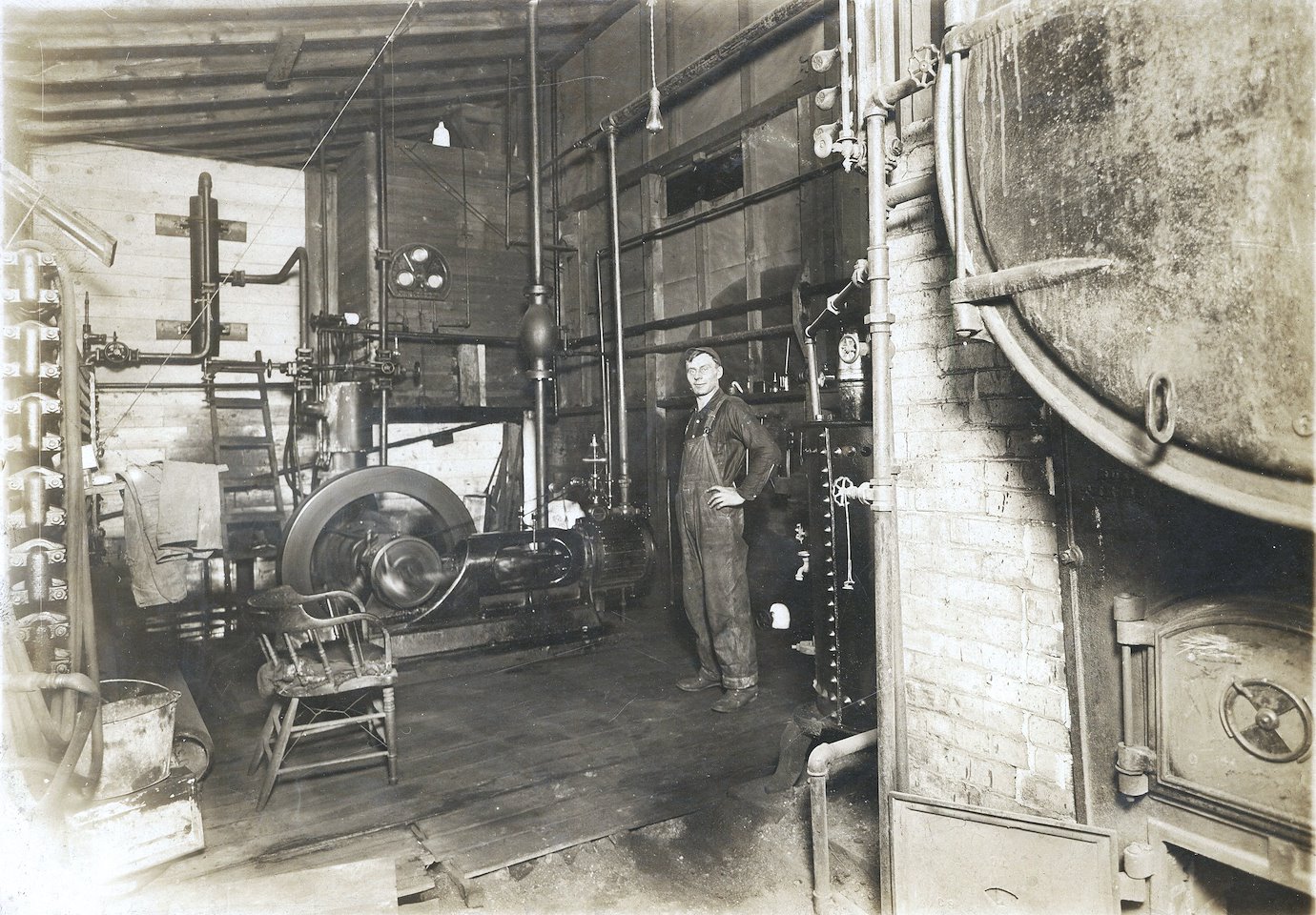 Image of a man near a coal boiler