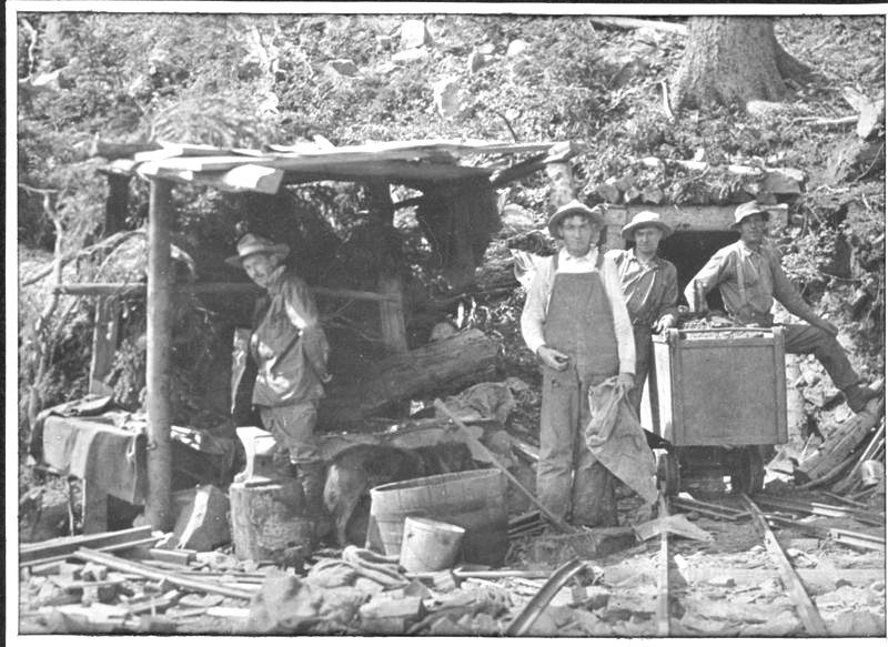 Image of miners outside of a mine