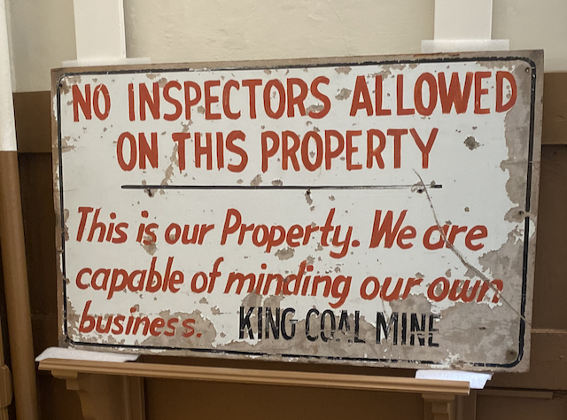 Sign saying No inspectors allowed on this property