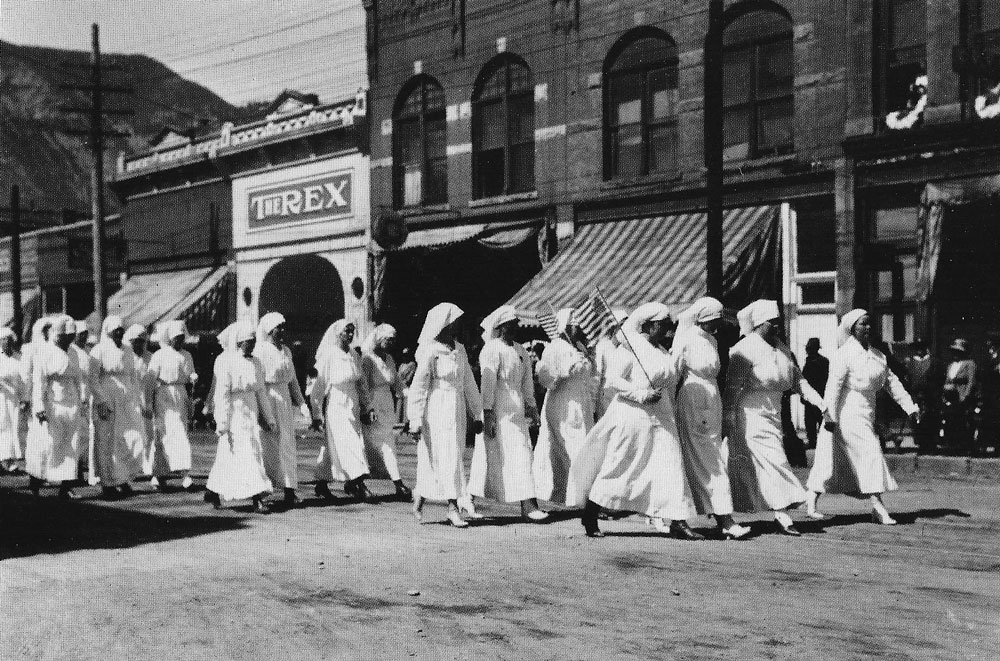 Red Cross workers on parade width=