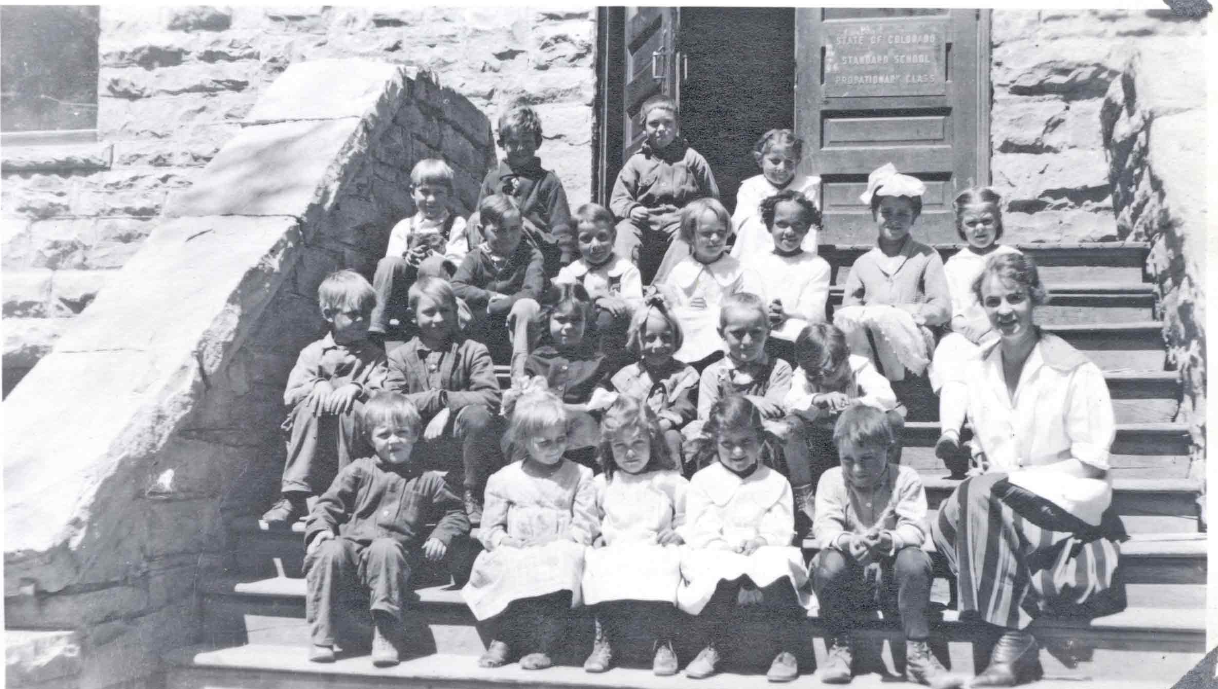 Class on school steps