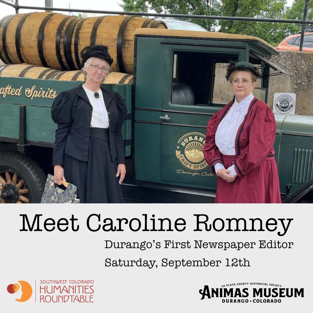 two women in 1880s clothes pose before an antique truck